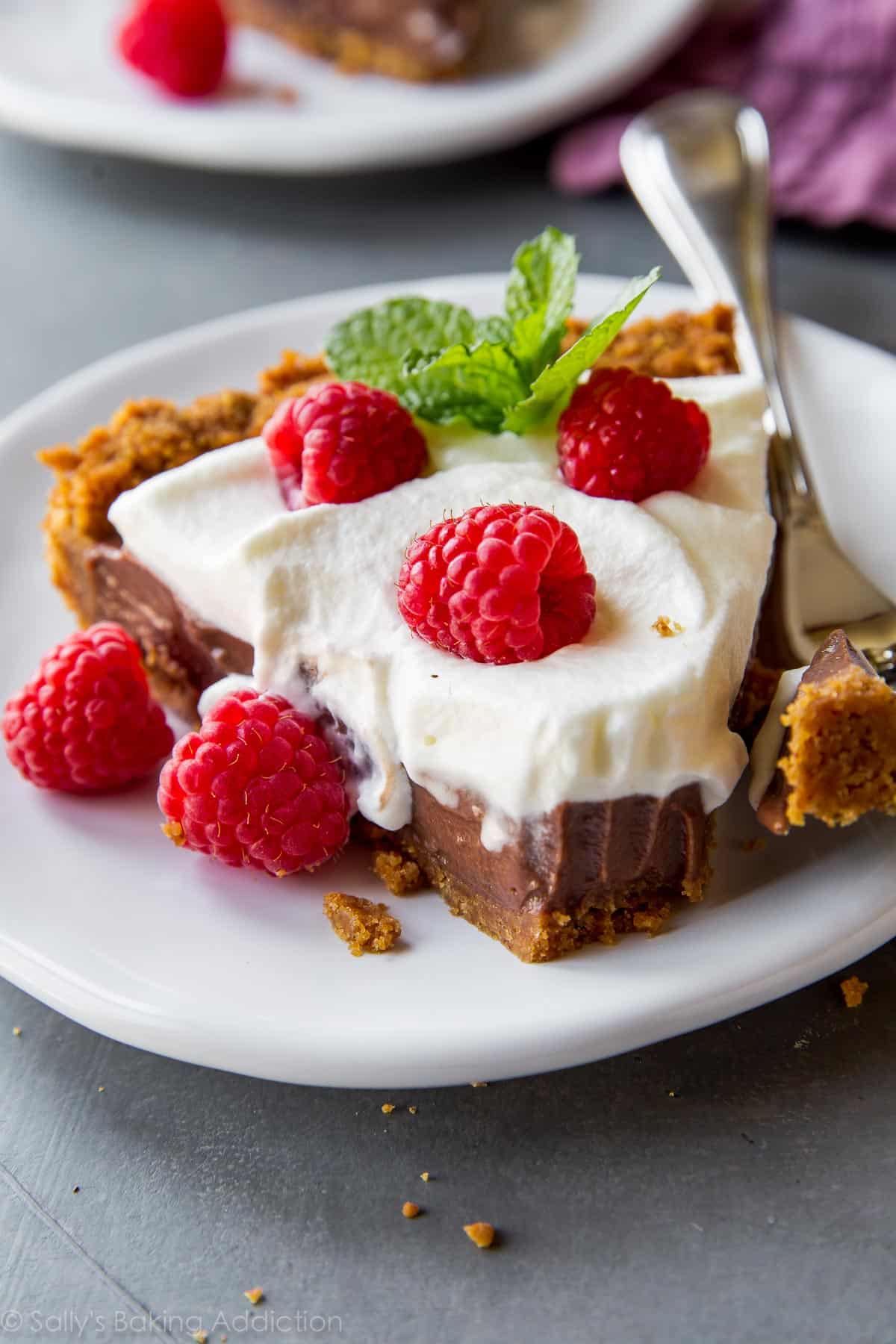 slice of chocolate pudding pie on a white plate with a fork
