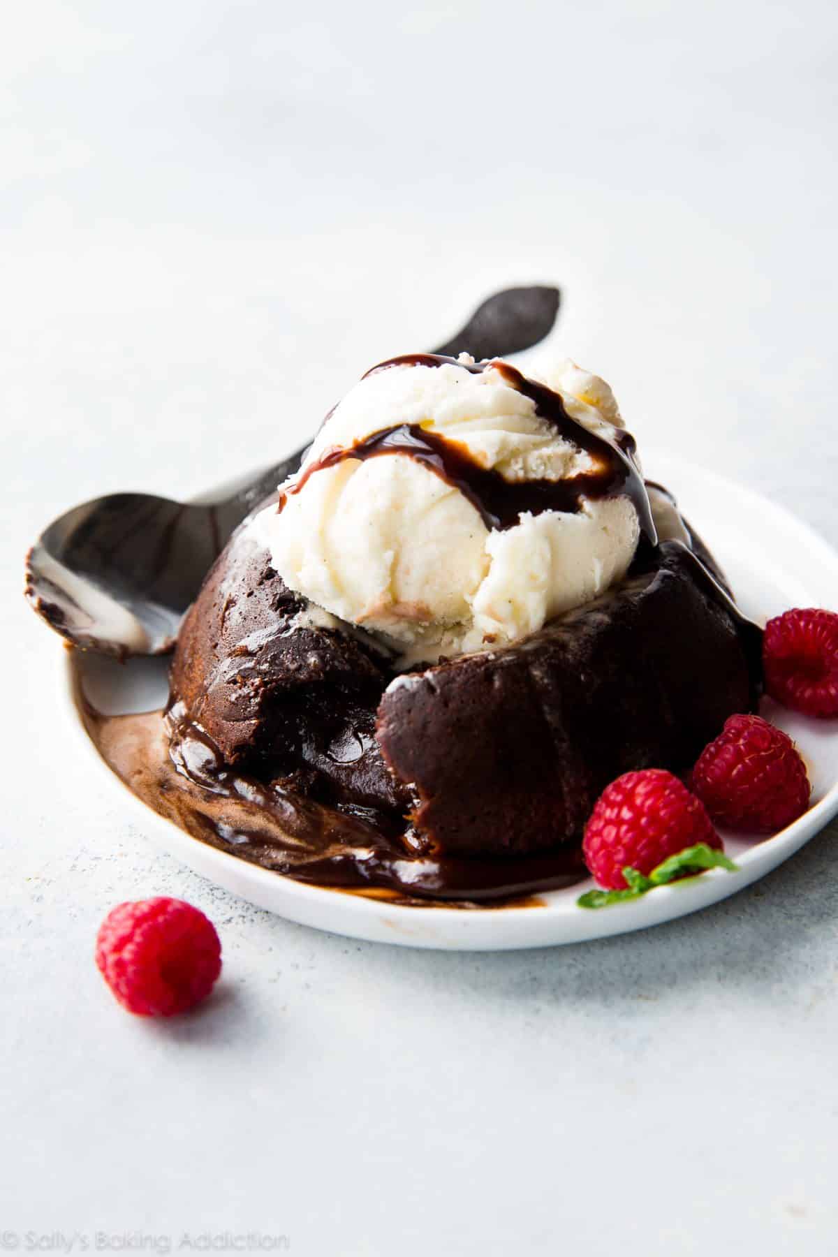chocolate lava cake with a scoop of vanilla ice cream on a white plate