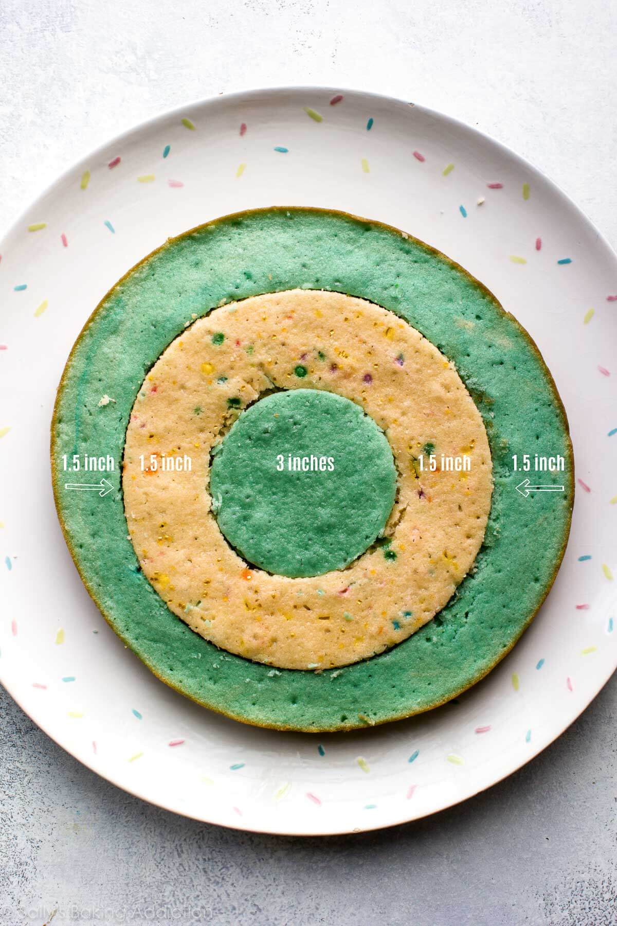 bottom layer of checkerboard cake with alternating rings of cake circles