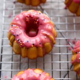 Mini pound cakes with raspberry icing and sprinkles