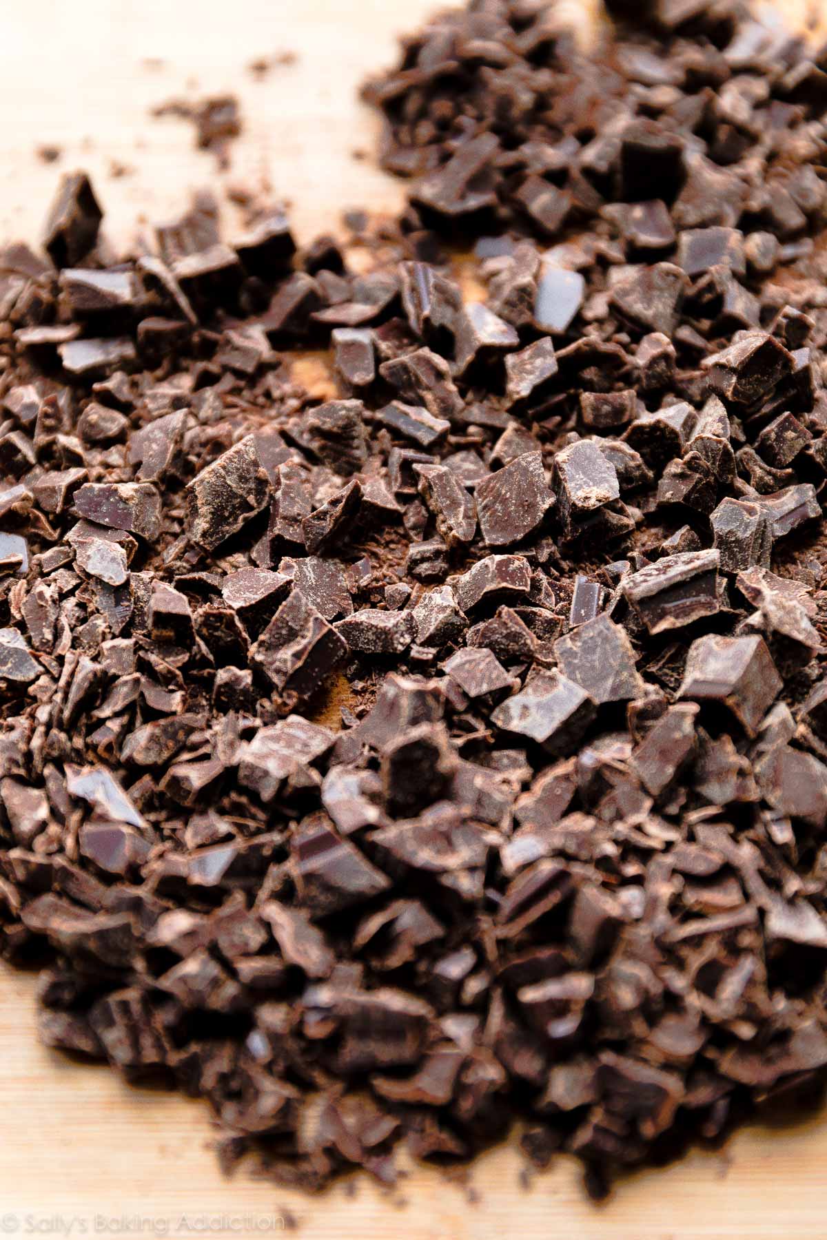 chopped chocolate on a wood cutting board