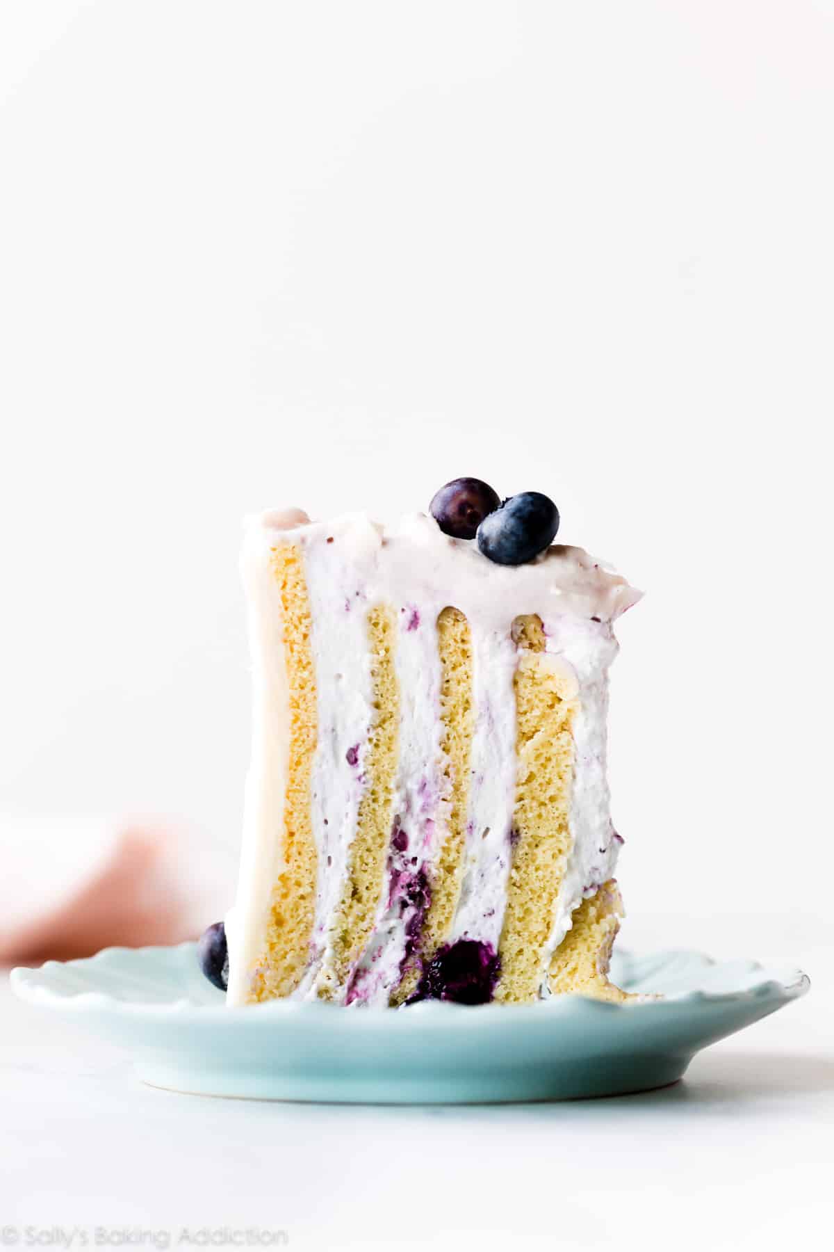 vertical cake slice on a blue plate