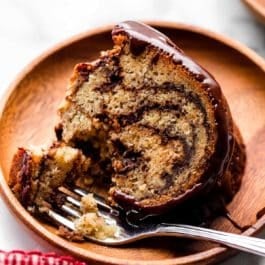 slice of chocolate marble banana bundt cake on plate