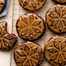 chocolate stamped cookies with icing.